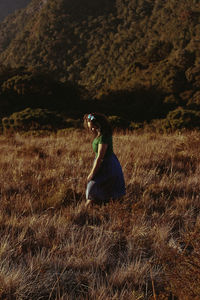 Woman walking on field