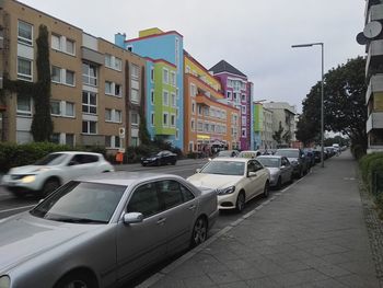 Cars parked along a narrow street