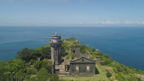 Aerial view of lighthouse in palau island. lighthouse in cape engano against blue sky