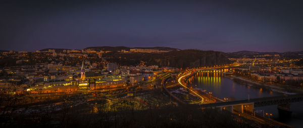 High angle view of illuminated buildings in city at night