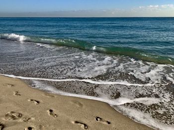 Scenic view of beach against sky