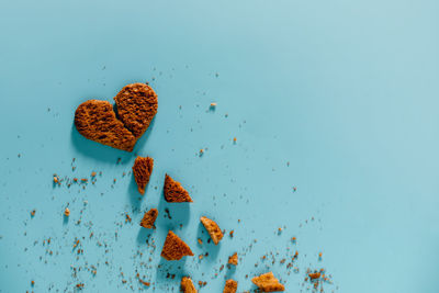 High angle view of bread on table against blue background