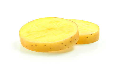 Close-up of lemon slice against white background