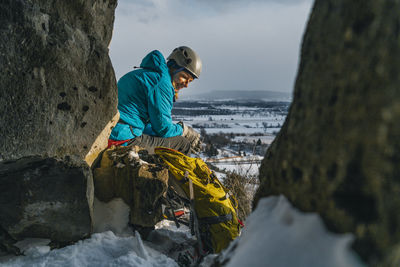 Ray of sun warms ice climber