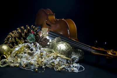 Close-up of christmas decorations on black background