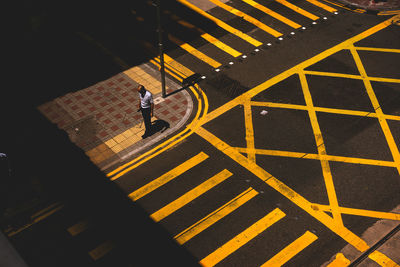 Shadow of people walking on road