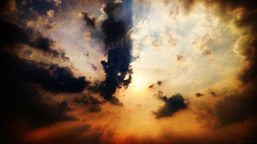 Low angle view of dramatic sky during sunset