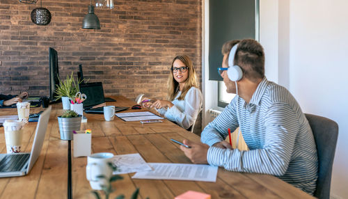 Business person talking wile sitting in boardroom