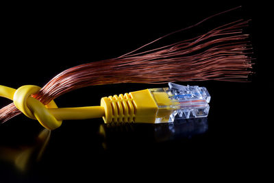 Close-up of yellow fire against black background