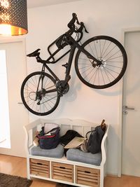 Bicycle leaning against wall at home