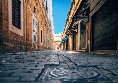 Man on cobblestone street in city