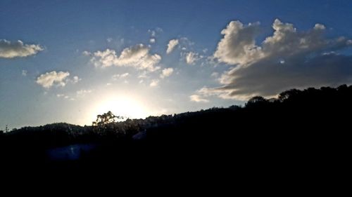 Silhouette landscape against sky during sunset