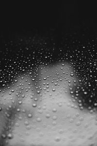 Close-up of water drops on glass