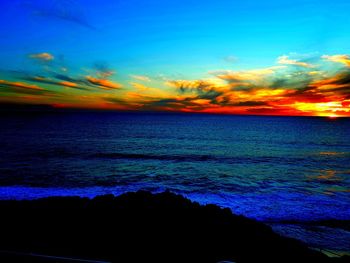 Scenic view of sea against sky during sunset