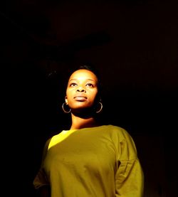 Woman standing in darkroom