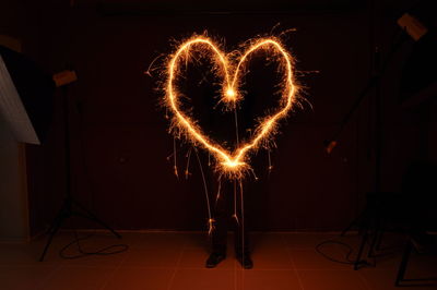 Man making heart shape with wire wool