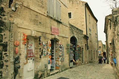 People on road amidst buildings