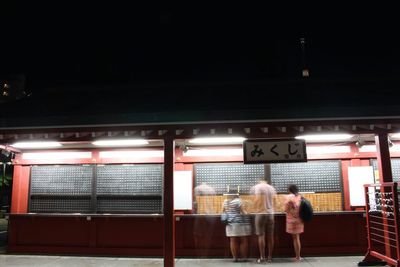 Woman standing at night