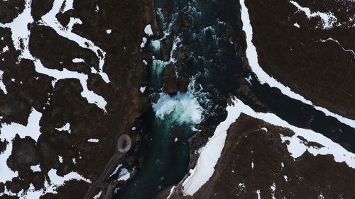 Close-up of snow on water