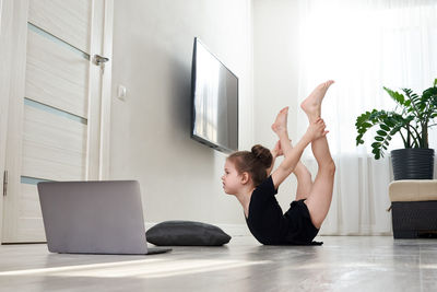 Girl doing yoga at home