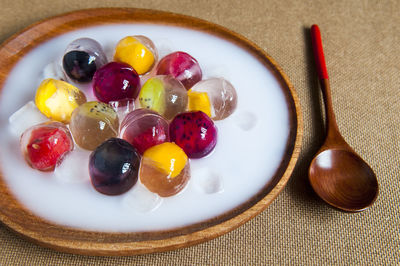 Directly above shot of fruit jelly dessert served in plate on table