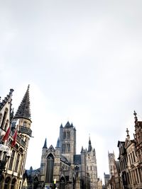 Low angle view of buildings in city against sky
