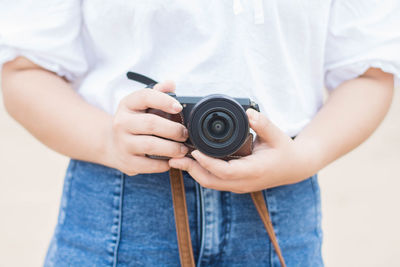 Midsection of person photographing