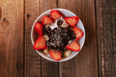 High angle view of strawberries in bowl on table