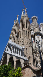 Low angle view of building against blue sky