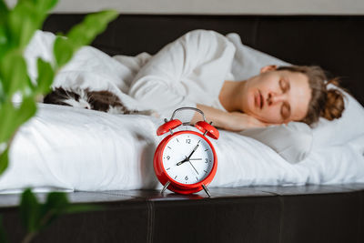 Young woman sleeping on bed at home