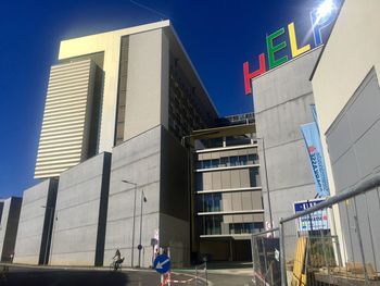 Low angle view of modern buildings against sky in city