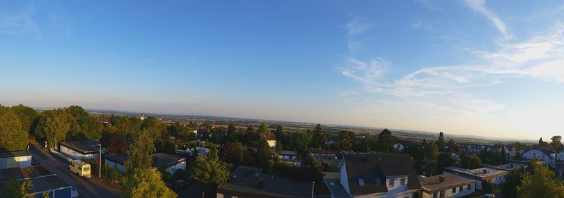 Panoramic view of trees against blue sky