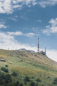 Low angle view of communications tower against sky