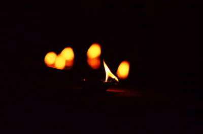 Illuminated candles at night