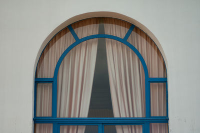 Low angle view of arch window of house