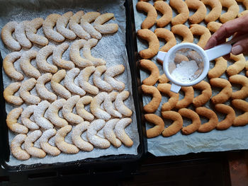 High angle view of cookies on baking tray 