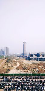 View of city buildings against clear sky