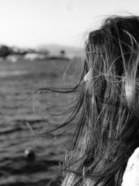 Close-up portrait of woman with hair
