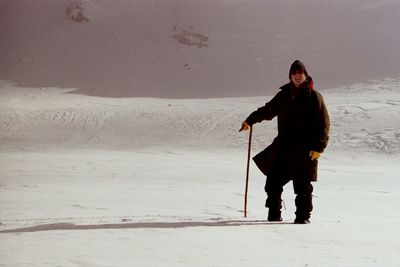 Full length of man standing on snow