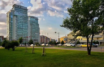 View of city street against blue sky