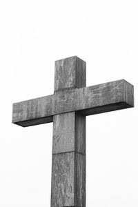 Low angle view of cross against clear sky