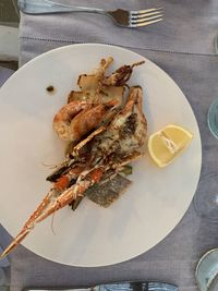 High angle view of fish in plate on table