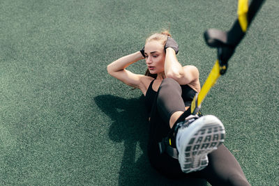 High angle view of woman lying on floor