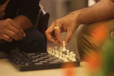 People playing chess at home