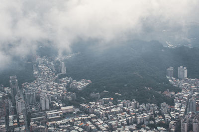 High angle view of buildings in city against sky