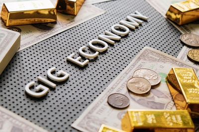 High angle view of coins on table