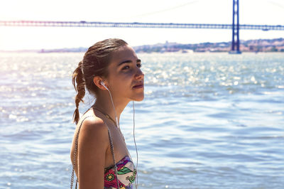 Young woman standing at beach