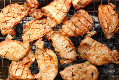 High angle view of meat on barbecue grill