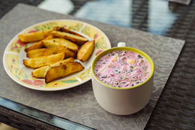 Cold lithuanian soup saltibarsciai, cold summer soup made of beetroot and kefir with baked potatoes