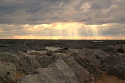 Scenic view of sea against cloudy sky